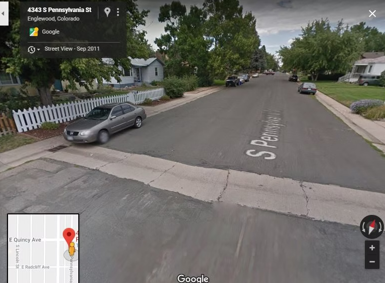 A suburban street view of S Pennsylvania St in Englewood, Colorado, with houses, trees, parked cars, and a white picket fence. The Google Maps label and inset map are visible on the image.